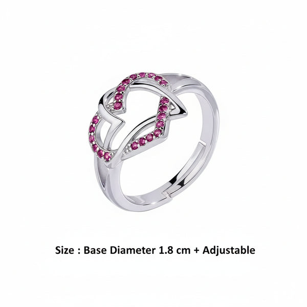 Silver ring with pink gemstones on a white background