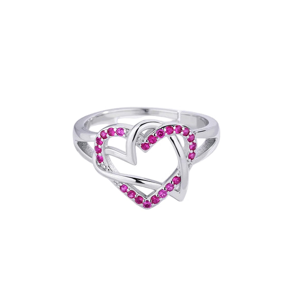 Silver ring with pink gemstones on a white background