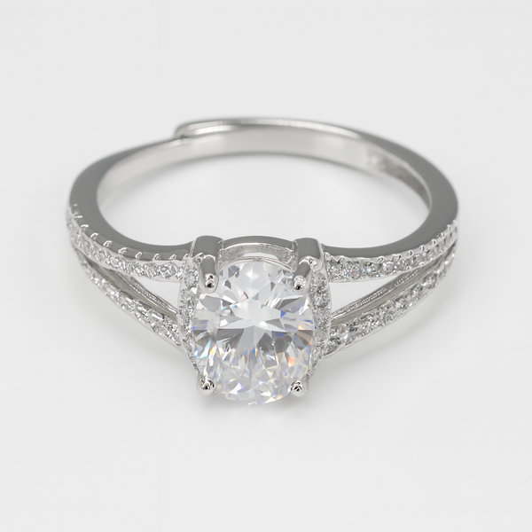 Silver ring with a large diamond on a light gray background