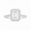 Diamond ring with emerald-cut center stone on a white background