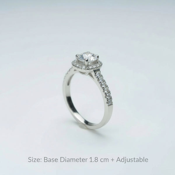 Silver ring with a diamond on a light gray background