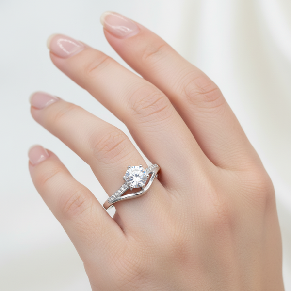 Silver ring with a diamond on a white background