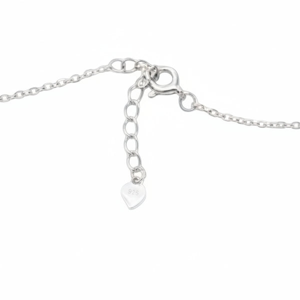 Silver necklace with heart pendant on a white background