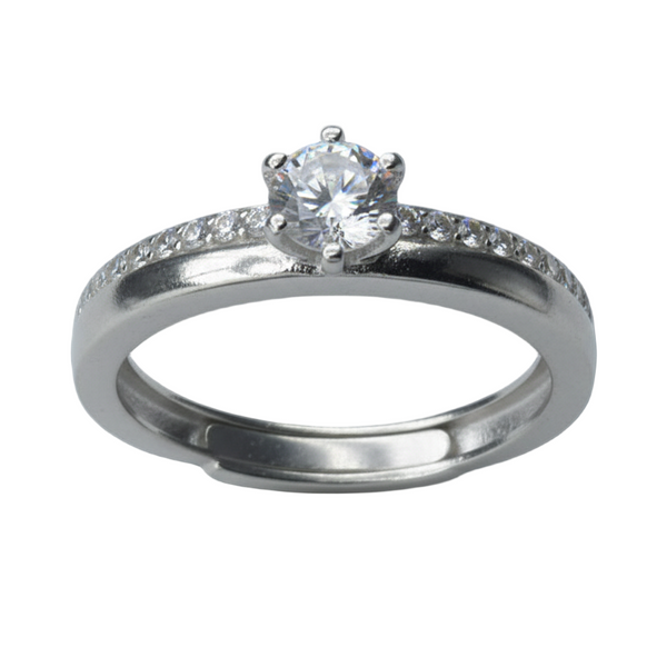 Silver ring with a diamond on a dark background