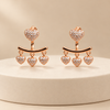 Heart earrings on a cream display