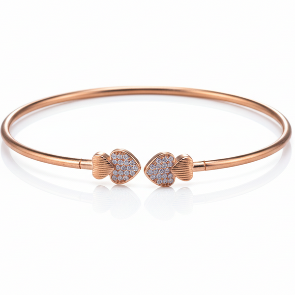 Rose gold bracelet with heart-shaped ends on a white background