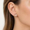 Model wearing the heart-and-pearl stud
