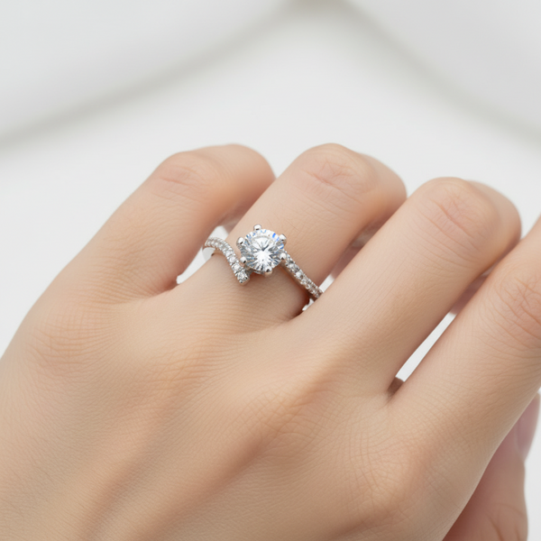 Silver ring with a large diamond on a white background