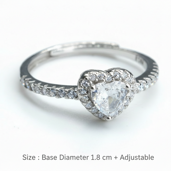 Silver ring with a heart-shaped diamond on a white background