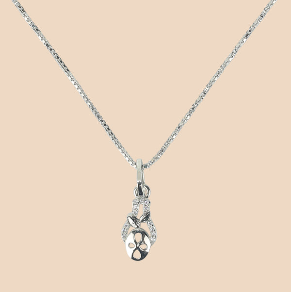 Silver necklace with a pendant on a light gray background