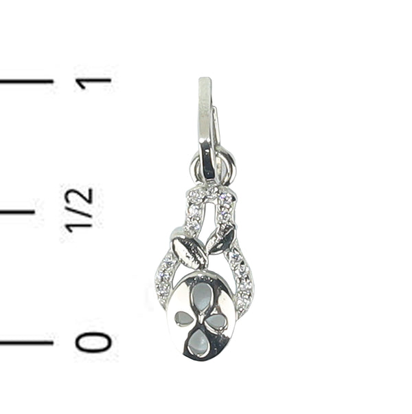 Silver pendant with floral design on a white background