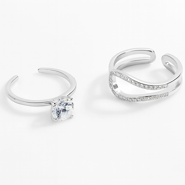 Two silver rings with gemstones on a white background