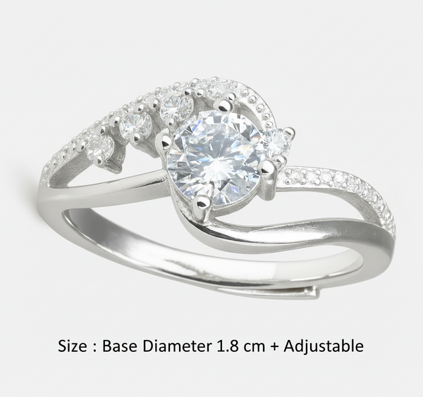 Silver ring with a central diamond and smaller stones on a white background