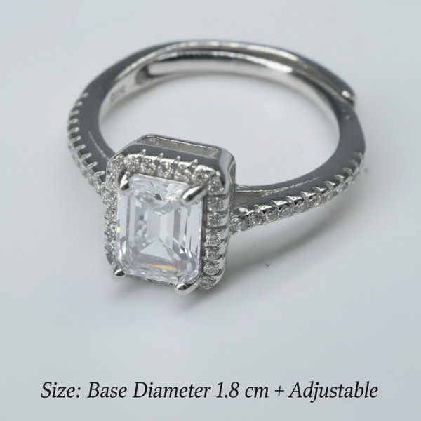 Silver ring with a diamond on a white background