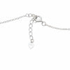 Silver necklace with heart pendant on a white background