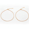 Two gold necklaces on a white background