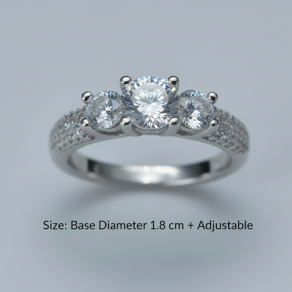 Silver ring with three diamonds on a gray background