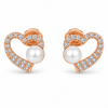 Heart-and-pearl earring pair on white