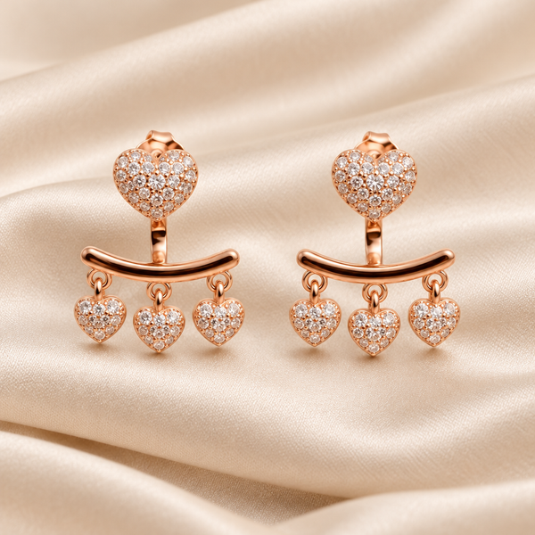 Heart earrings on champagne silk