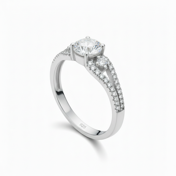 Silver ring with a large diamond and smaller diamonds on the band against a white background