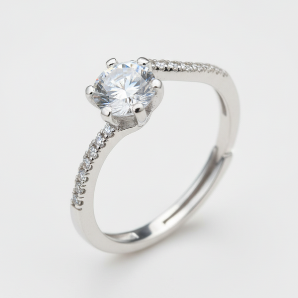 Silver ring with a large diamond on a white background